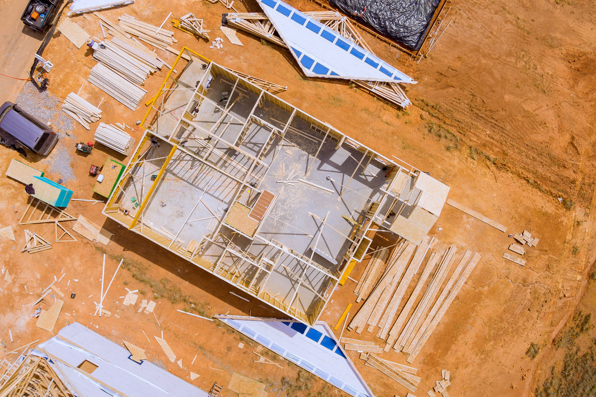 Aerial view of building wooden house structure.