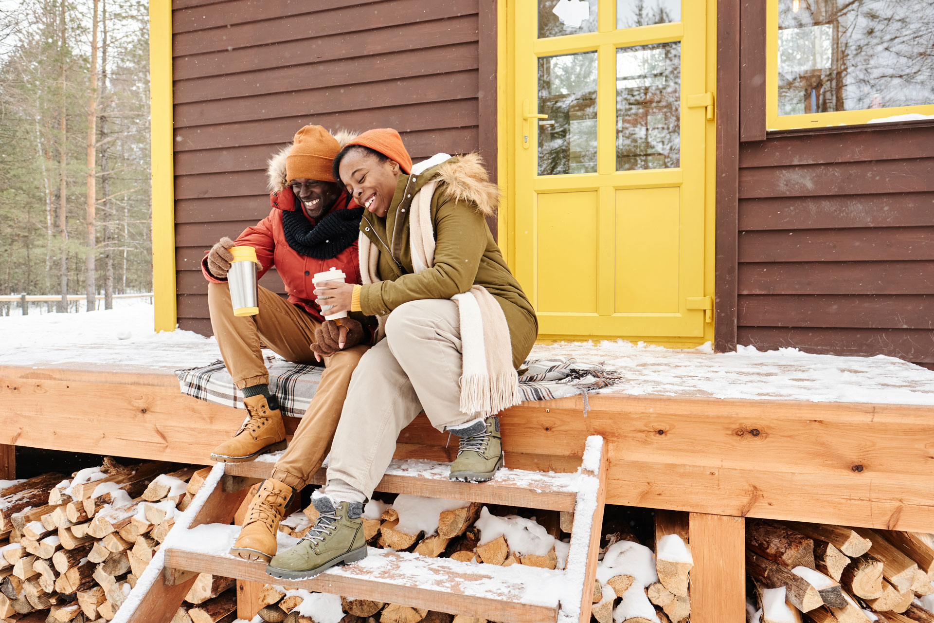 Couple outside their home during winter.