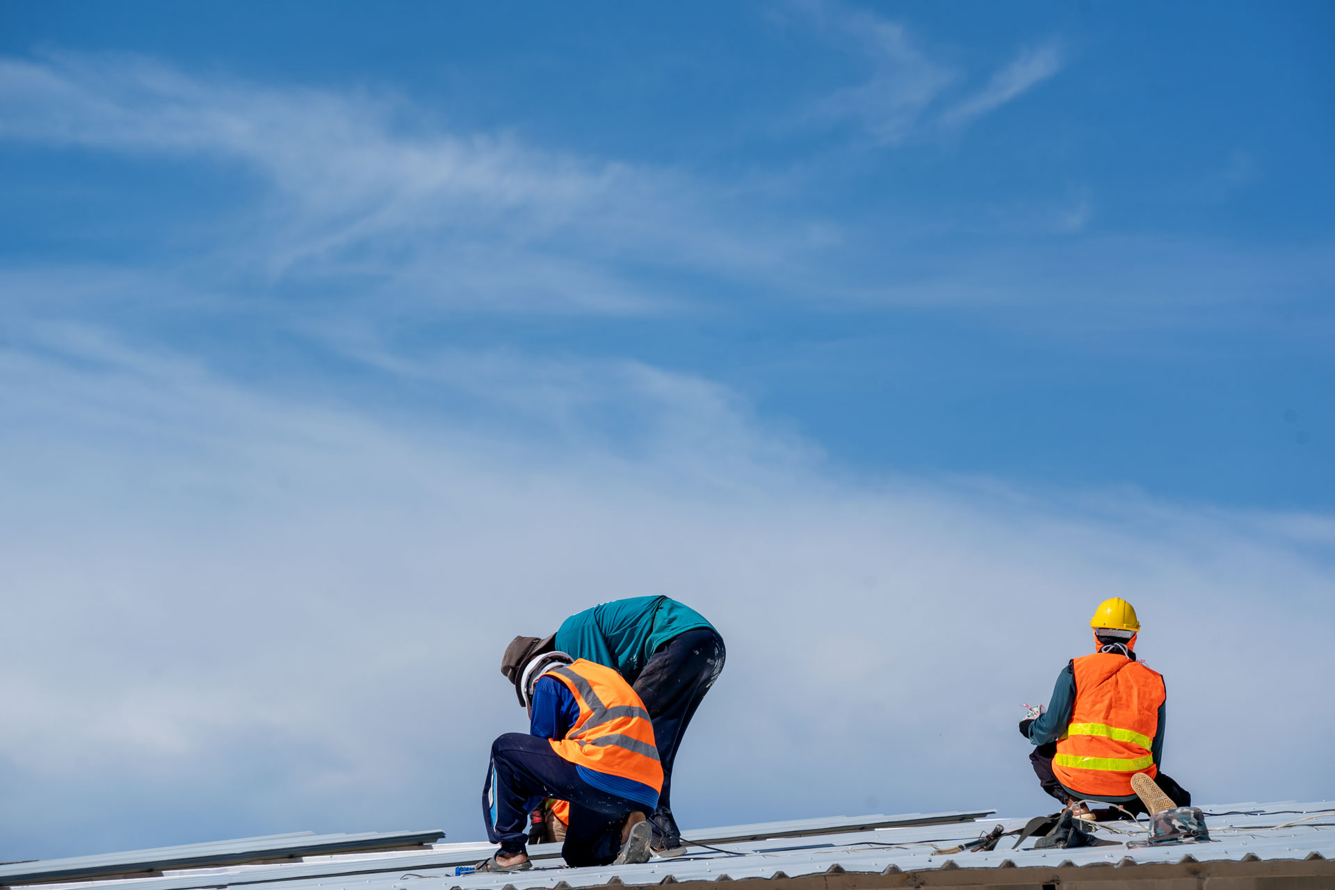 Roofer working.